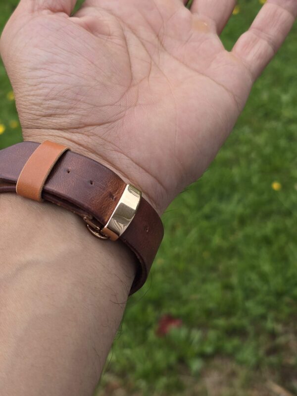 Apple watch strap on hand with deployant clasp