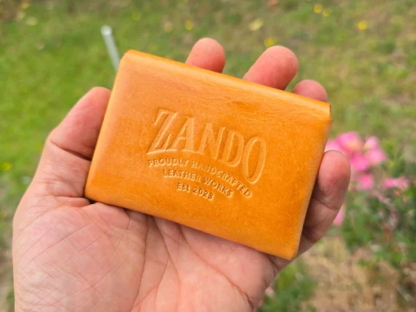 Honey coloured wallet in hand