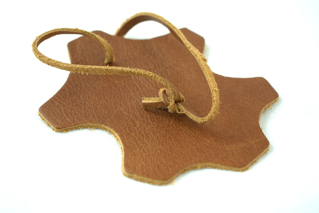 Leather symbol cut in leather