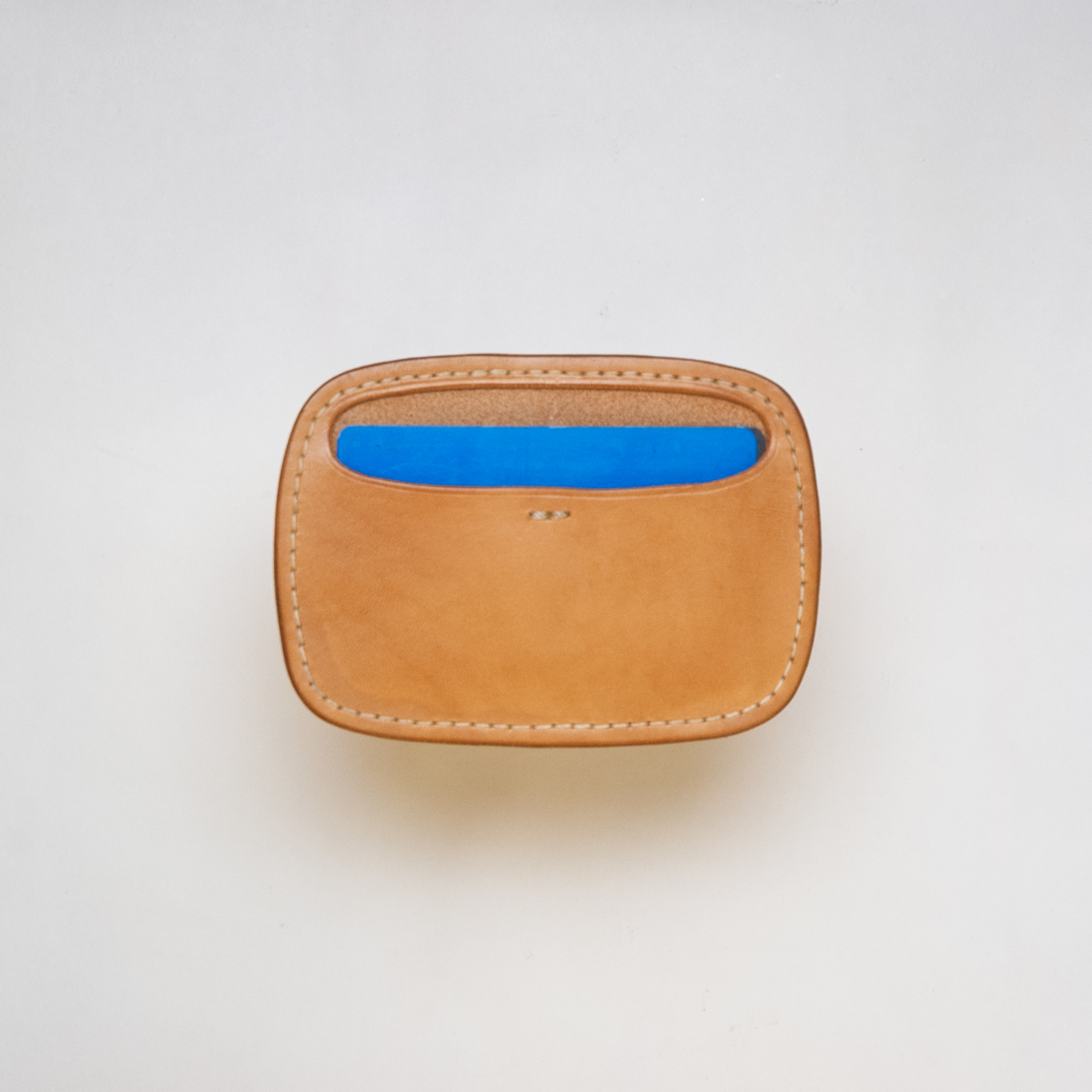 The Kakaruai Cardholder front with card